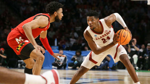 Alabama forward Brandon Miller (24) looks to make a move against a Maryland defender at Legacy Arena during the second round of the NCAA Tournament.